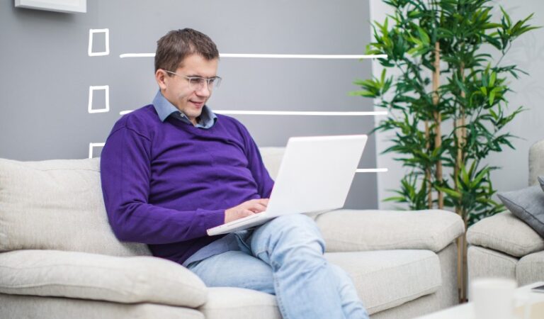 Best free online PDF editors, man on couch with laptop comparing PDF tools