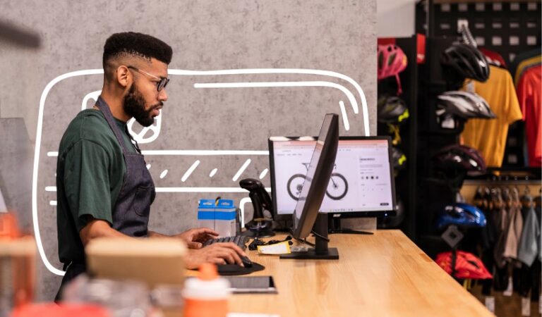 Small business owner using a POS system at a retail checkout counter