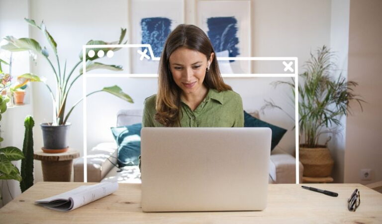 Woman using a laptop to compare the best CRM tools for her small business