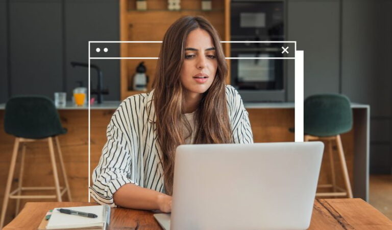 Woman learning how to make a website on a laptop at home