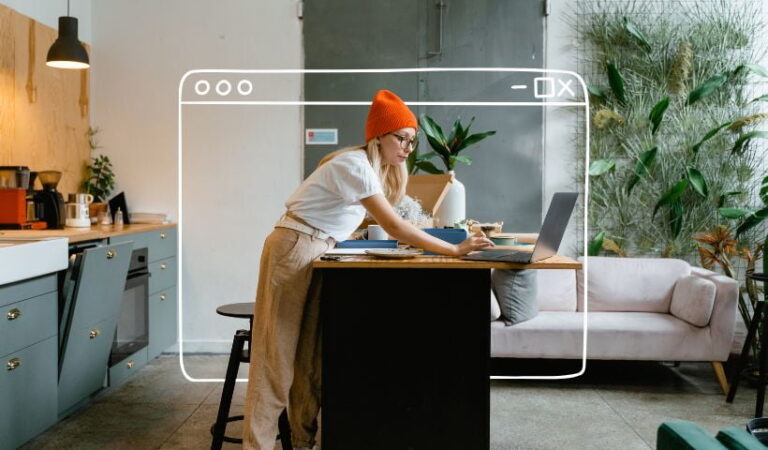 Woman working from home on laptop in kitchen home business ideas