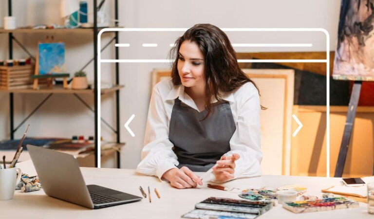 Woman artist working at her desk with a laptop, exploring online course platforms